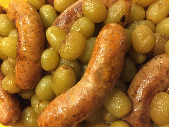 Roasted sausages and grapes