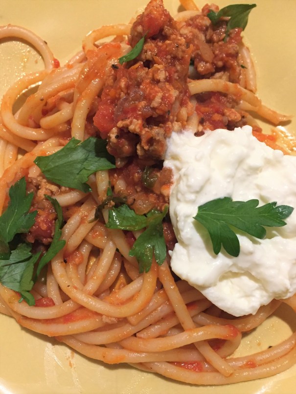 pasta with meat sauce and burrata